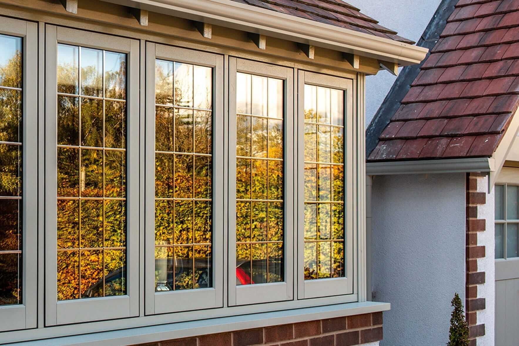 Light grey uPVC Flash sash windows installed on a cottage